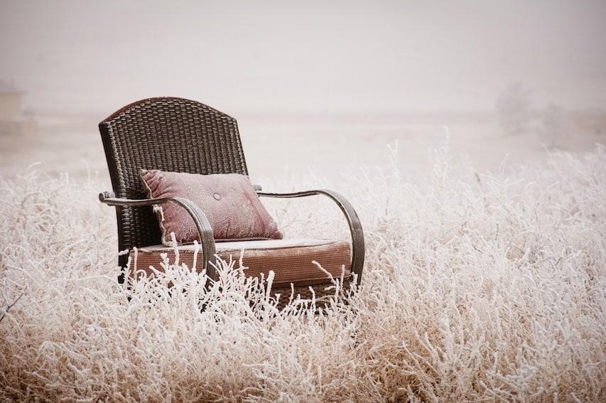 Vintage chair ona morning frost after a night of snow